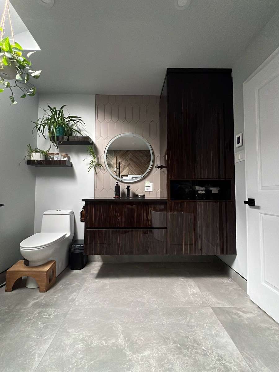 Wall-mounted dark wood bathroom vanity with round mirror and storage tower, by Limakdéco